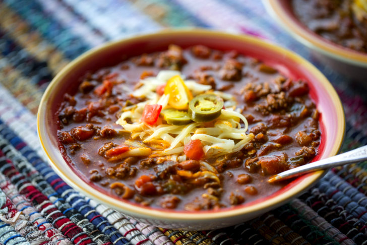 Texas Taco Soup with freshly grated cheese and jalapenos, up close