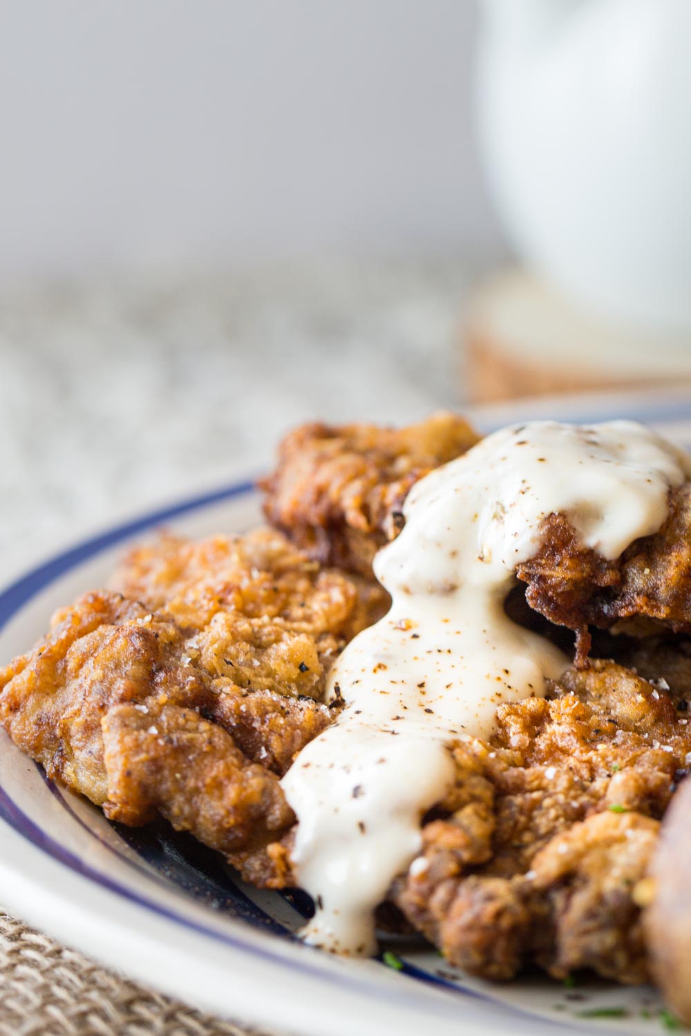 A close up of golden chicken fried steaks, crisp and perfectly fried.