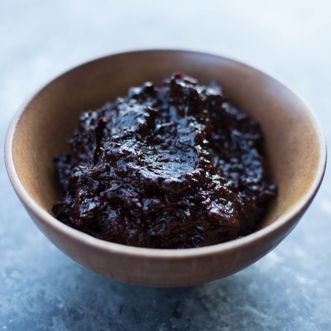 a brown bowl full of freshly made ancho paste