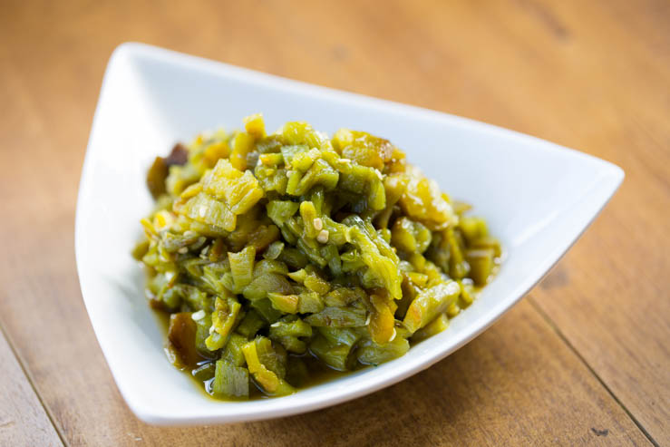 Freshly roasted and diced green chiles for Torchy's Queso recipe