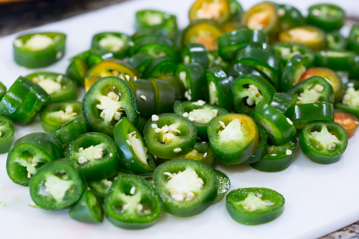 Coins of fresh jalapeno for escabeche