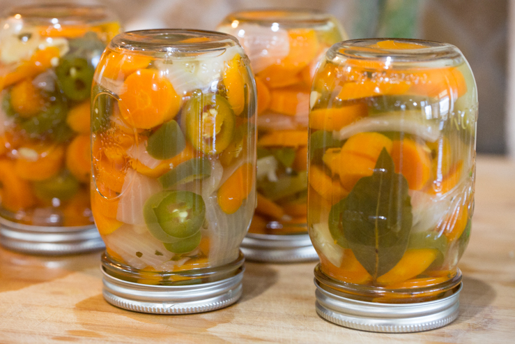 Canning jars of escabeche 