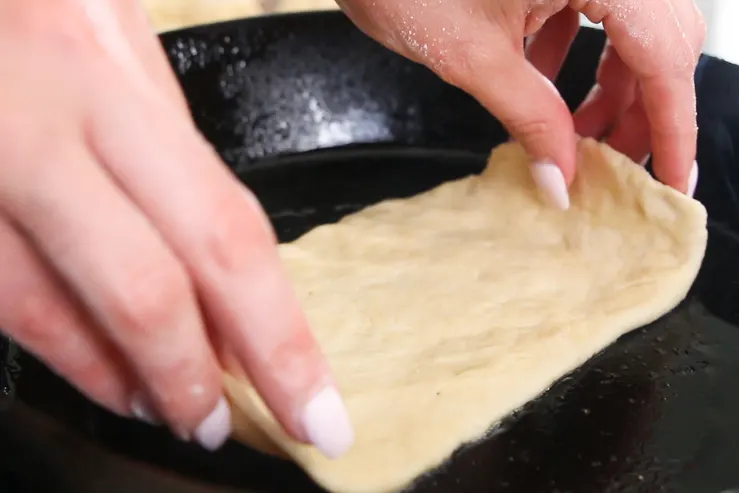 Bacon Fat Tortillas - Raw dough being laid on the skillet