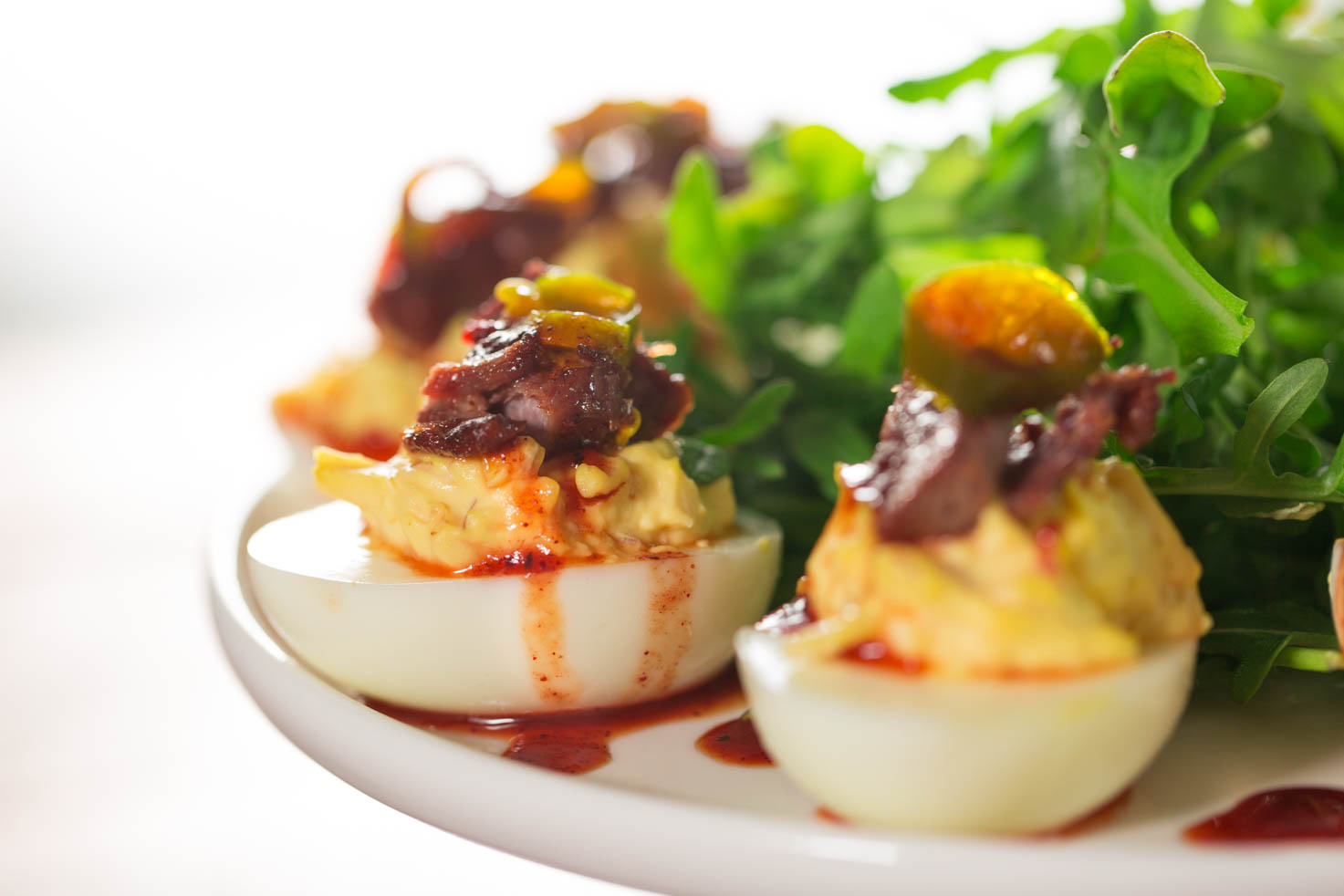 Brisket Deviled Eggs arranged on a plate