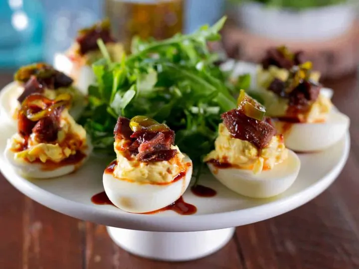 Brisket Deviled Eggs with Candied Jalapeno on a large platter