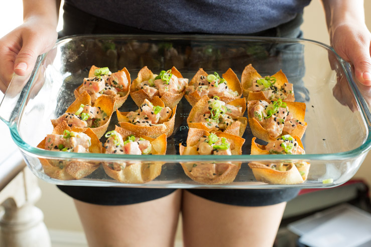 Jalapeno Poke in Wonton Cups being presented as if at a party.