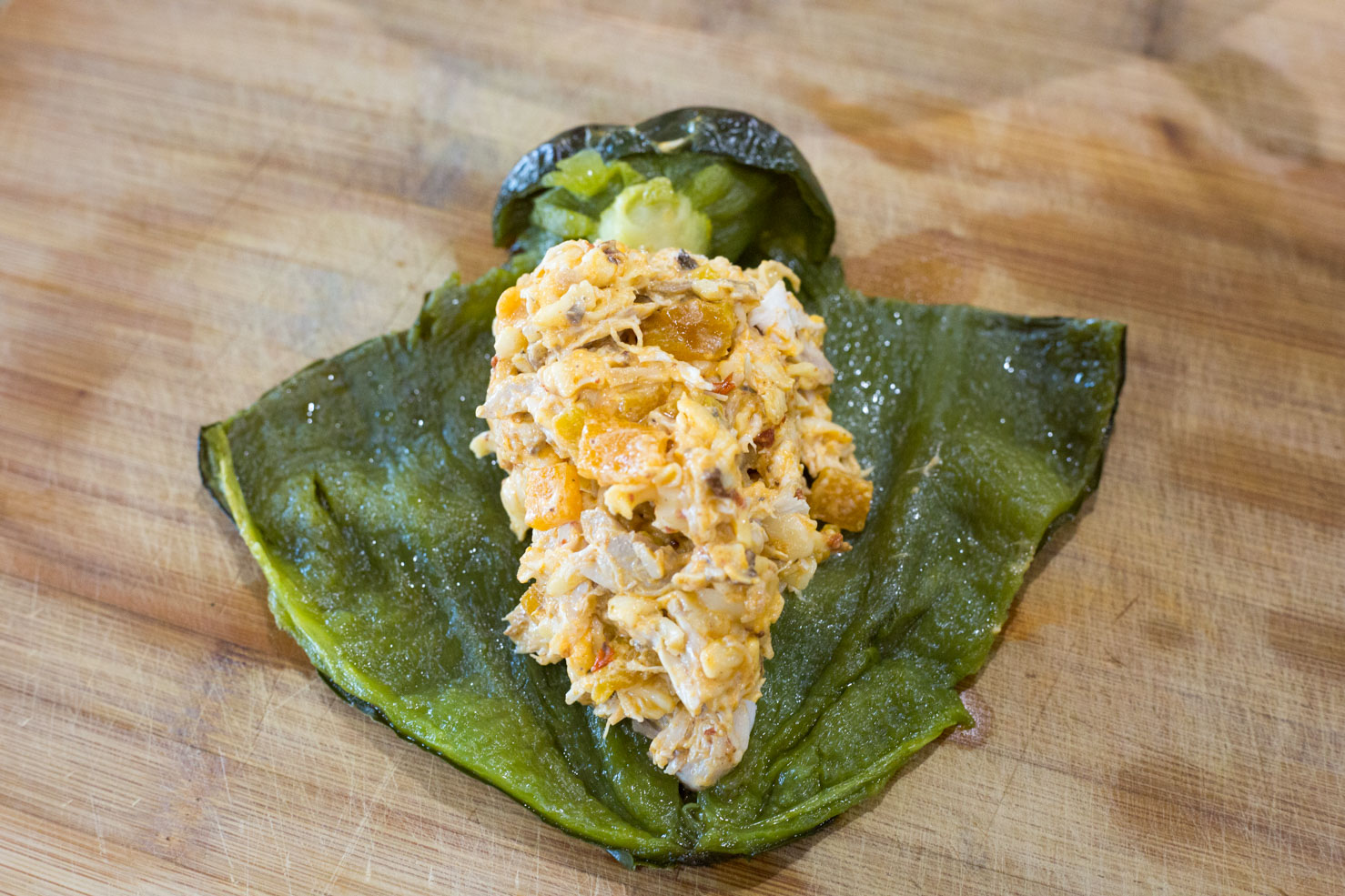 Stuffed peppers- filled with filling, and laid out to demonstrate the T-cut 