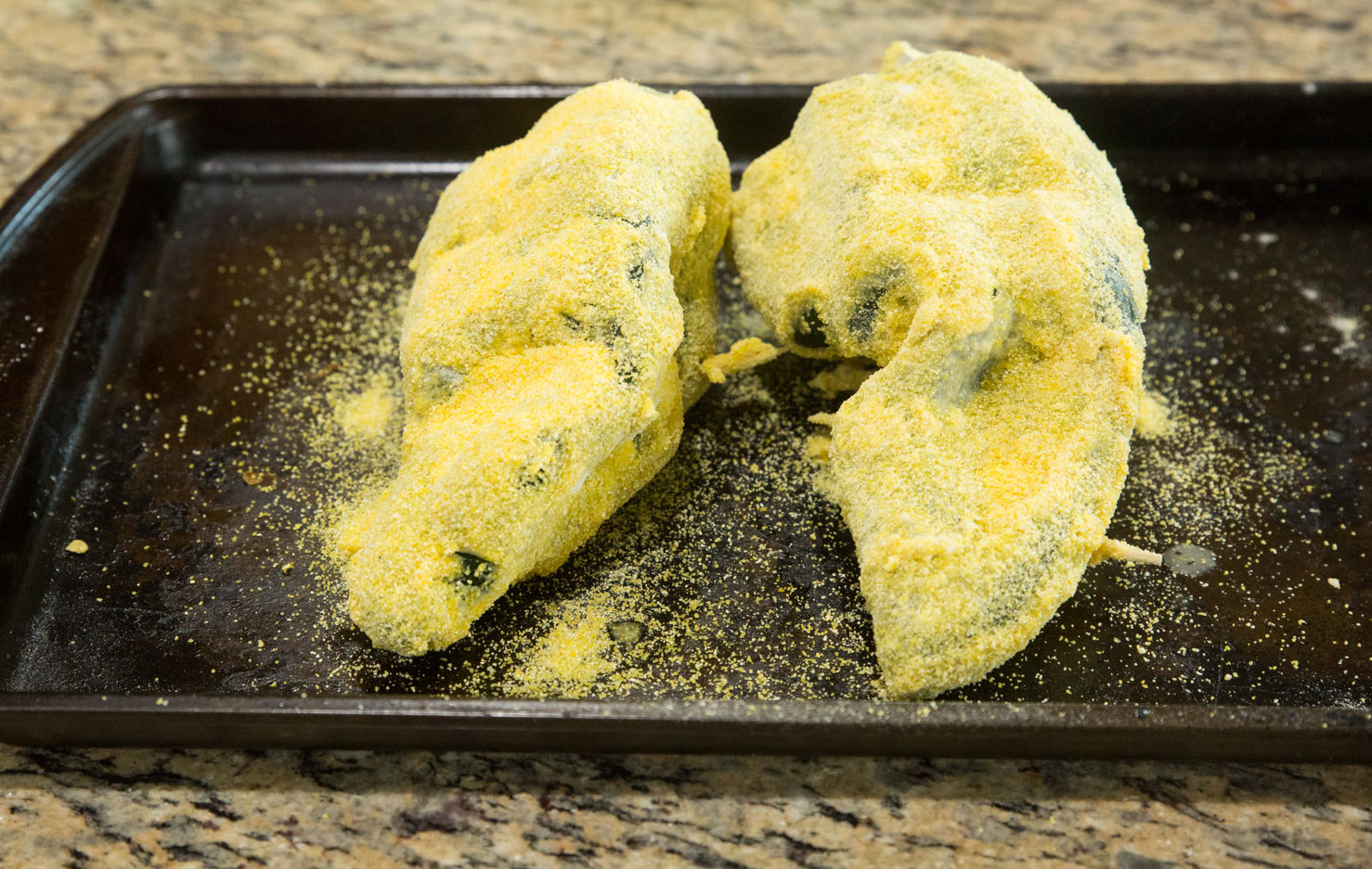 Stuffed Chile rellenos breaded in cornmeal batter