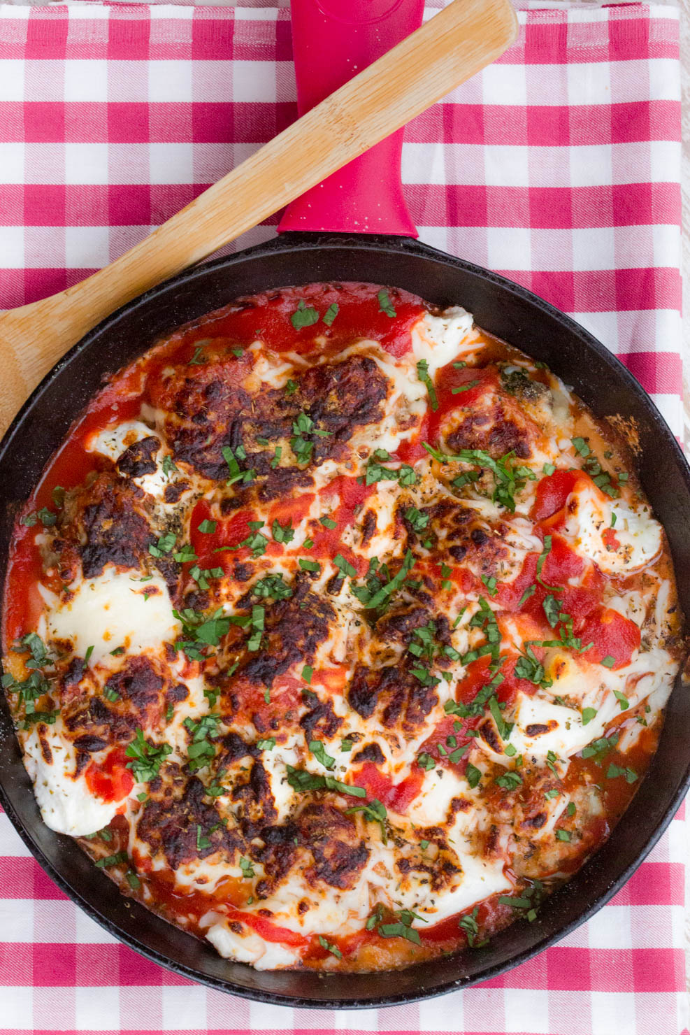 Meatball casserole recipe baked and presented on a red tablecloth 