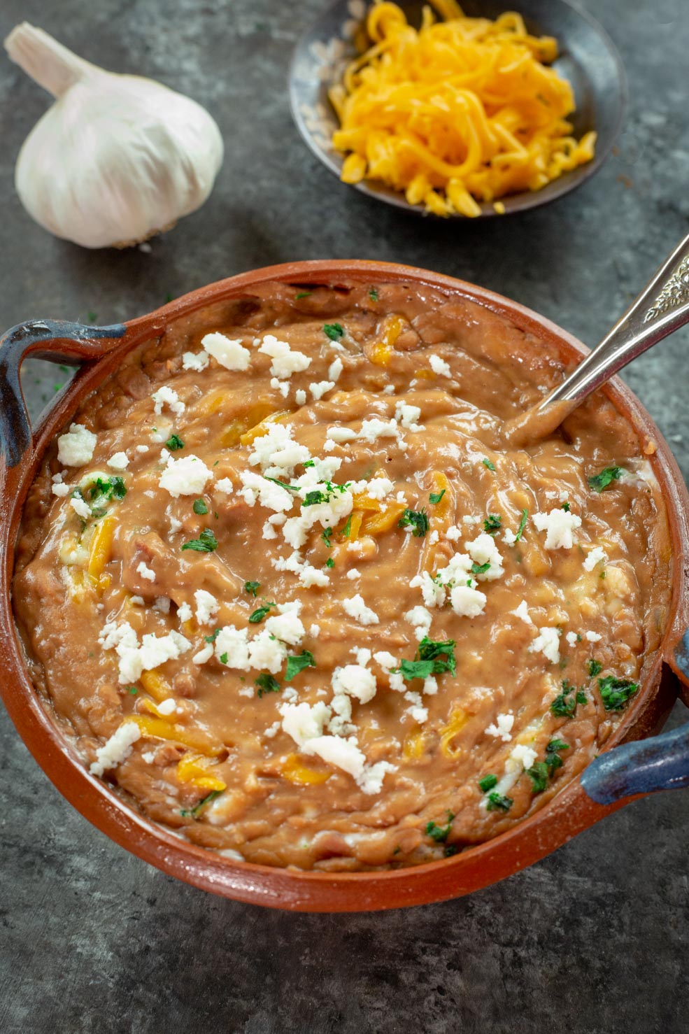 An elegant, large bowl of bacon fat refried beans