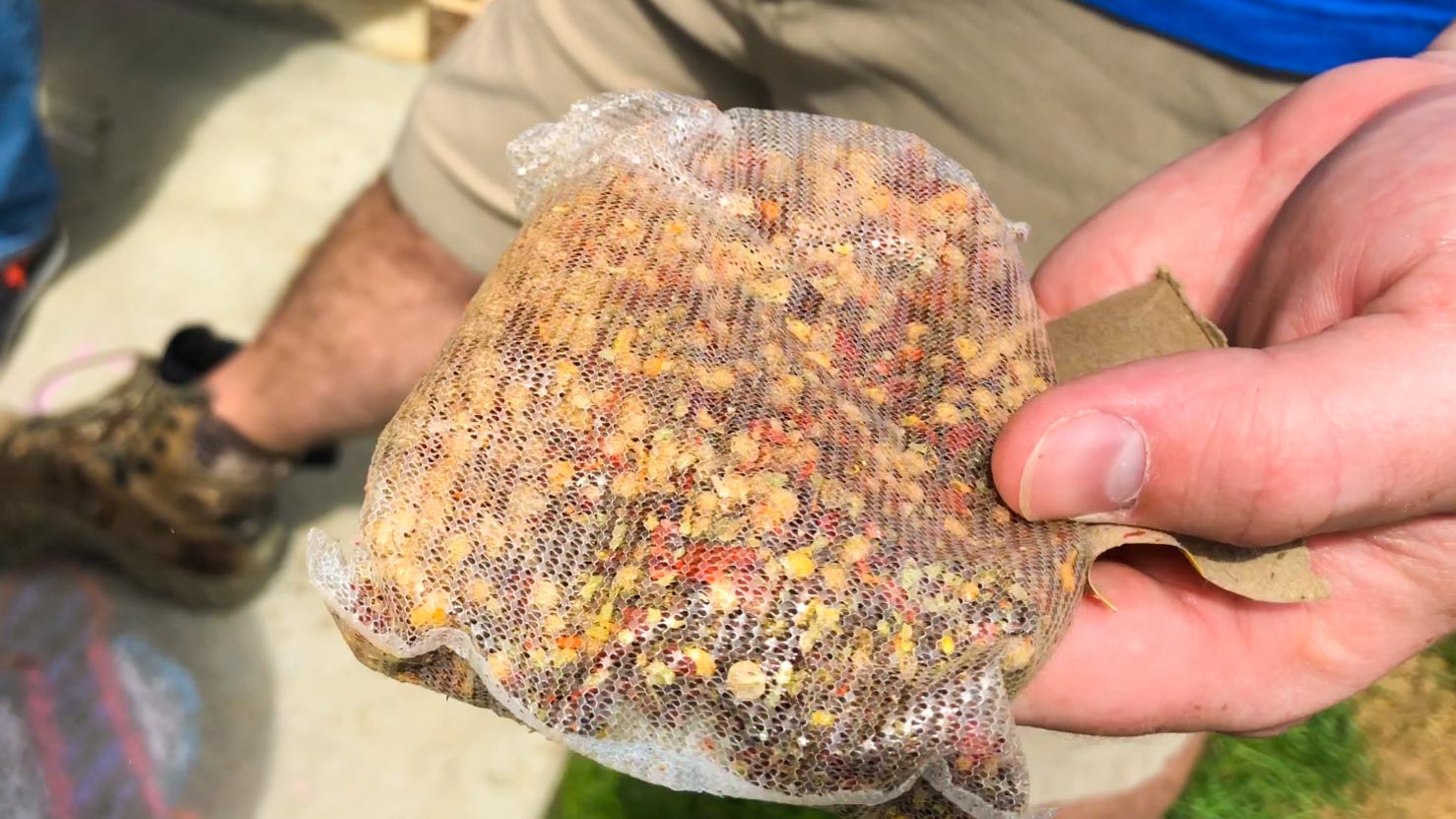 A close up of a Zatarain's mesh bag of crab boil herbs and spices. 