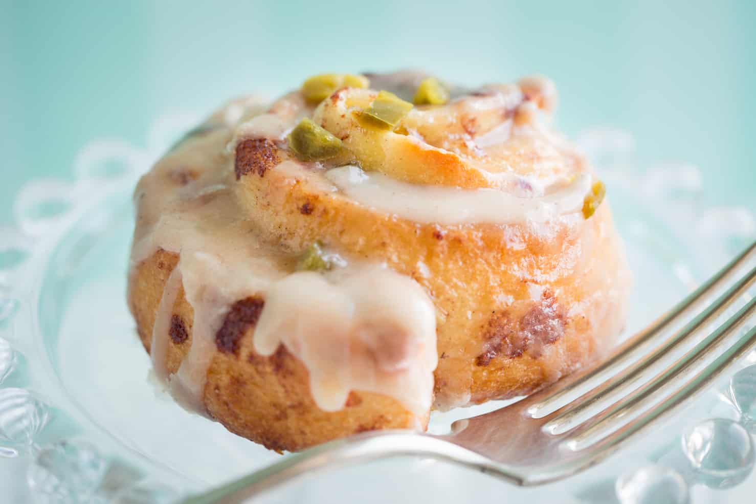 A jalapeno cinnamon roll on a plate