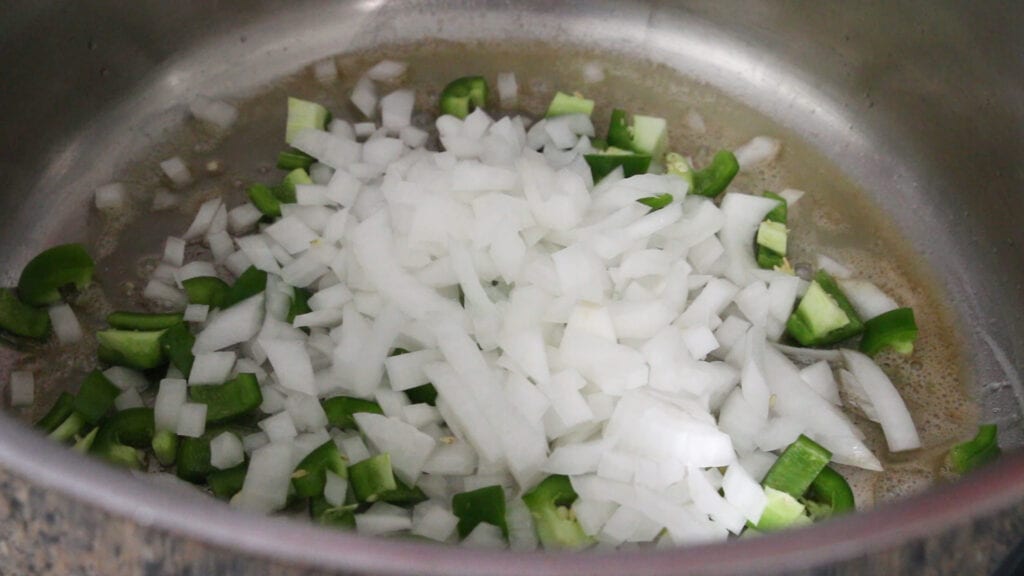 Sweating onions and jalapenos in butter for the white queso base