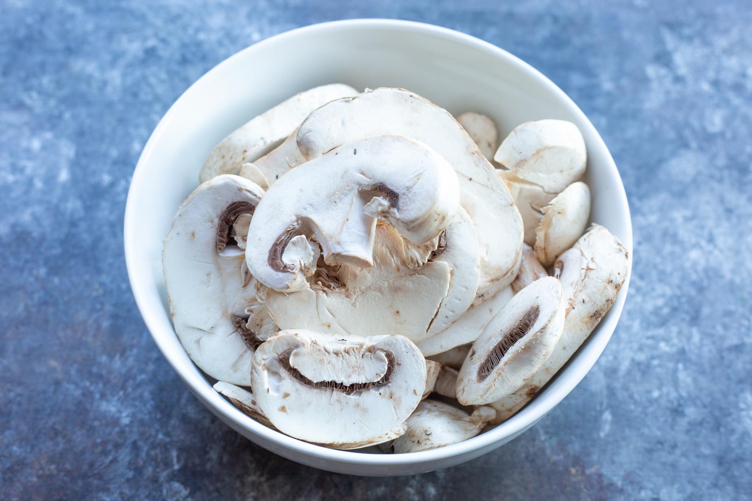 A bowl of button mushrooms