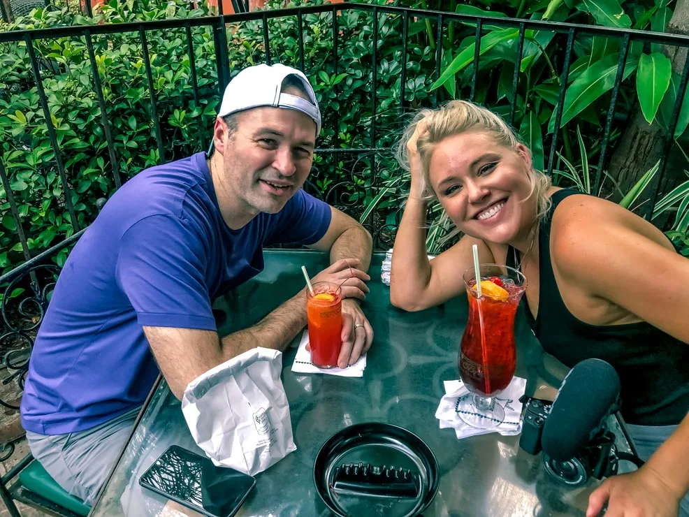 Dereck and Sarah drinking at Pat O'briens on the self guided food tour 