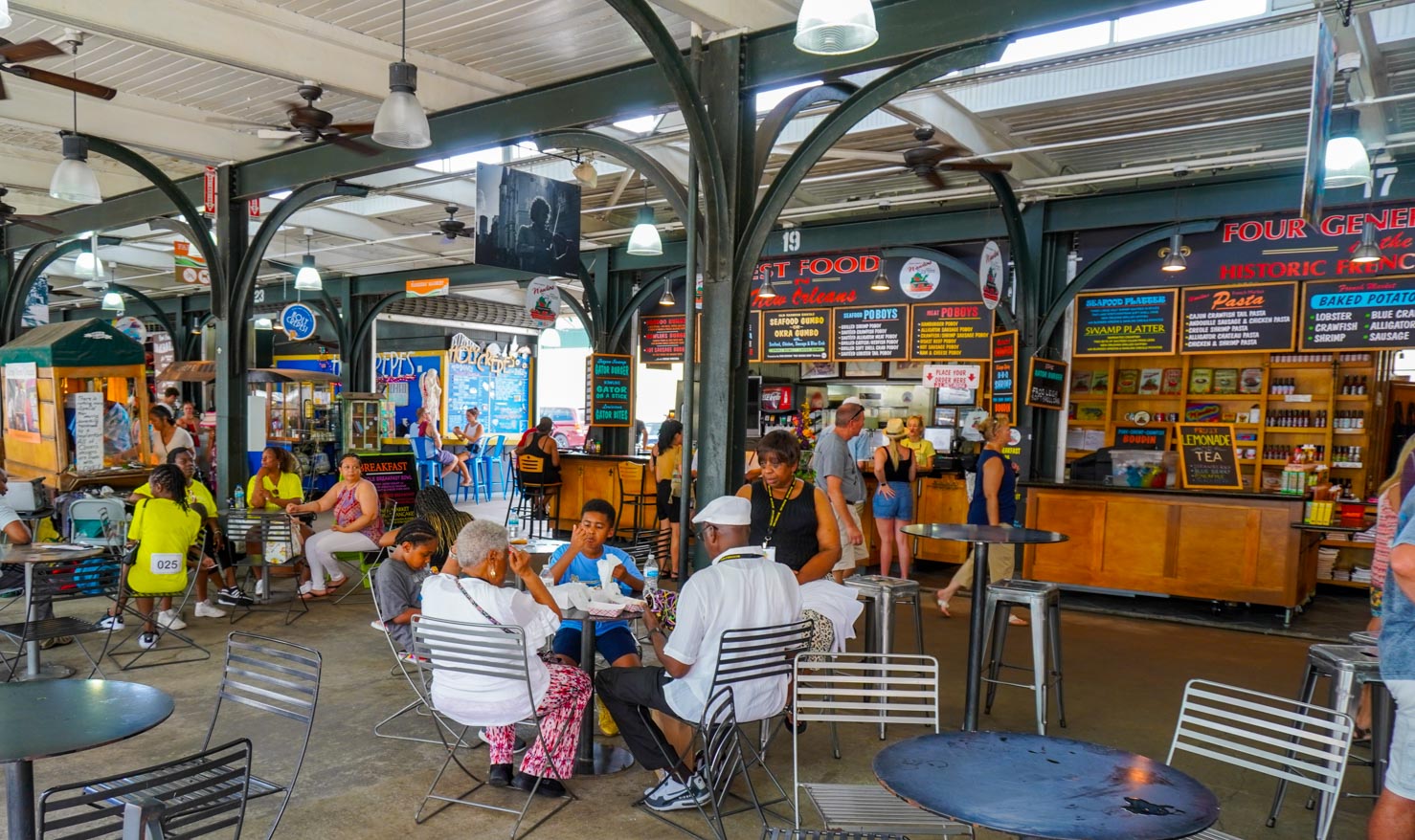 Tables of people at French Market in New Orleans