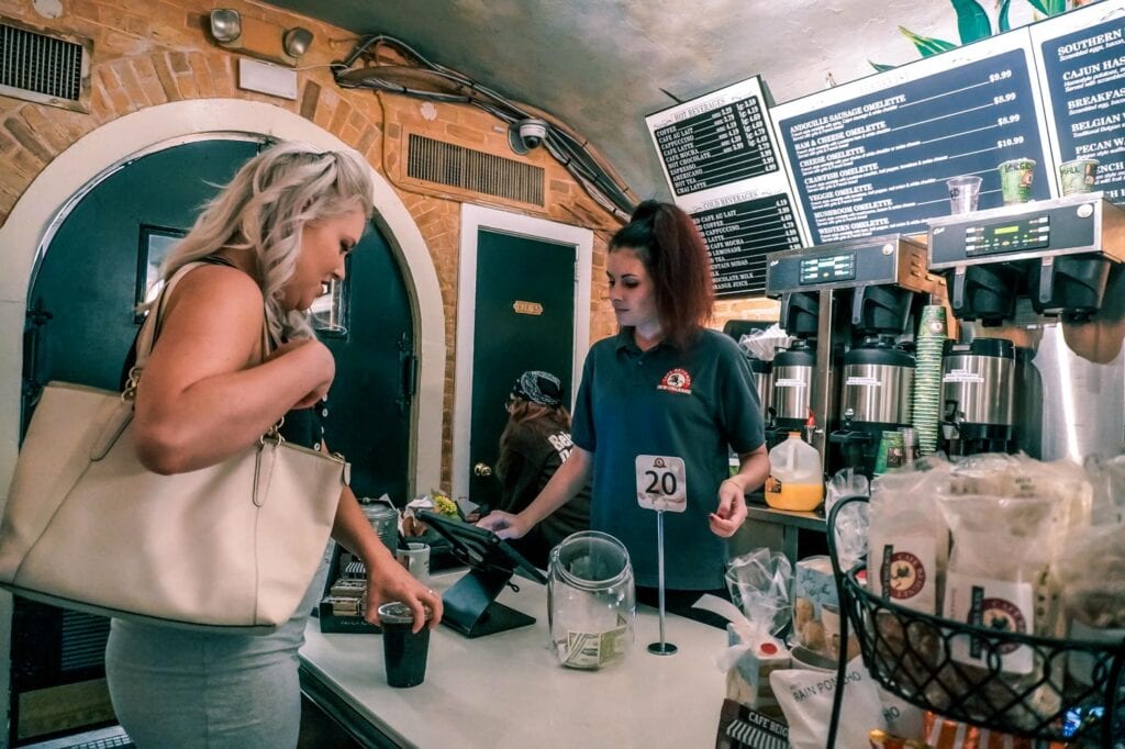 Ordering pastries at Cafe Beignet in New Orleans