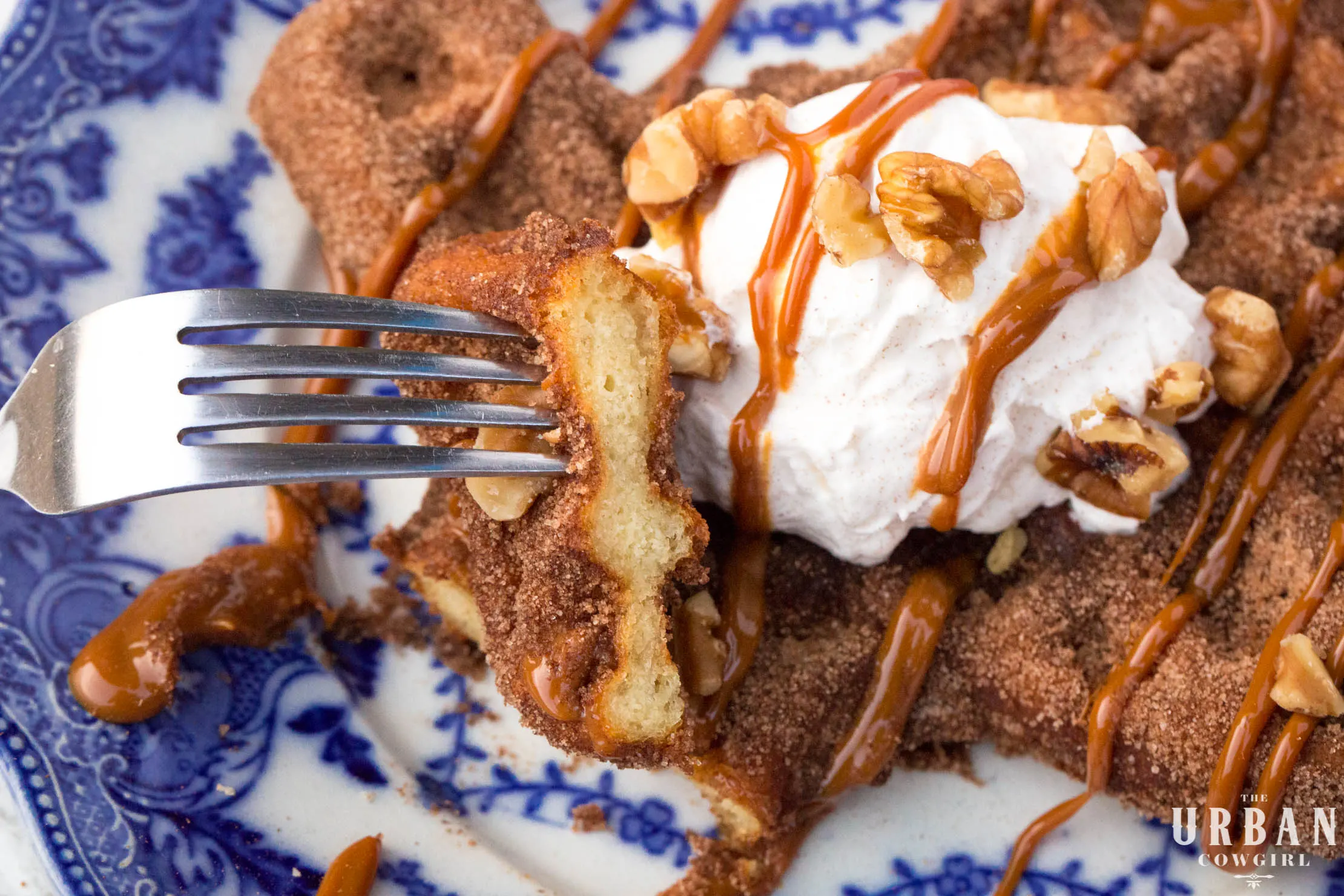 A close up shot of the Churro Waffle sliced into and showing the delicate crumb