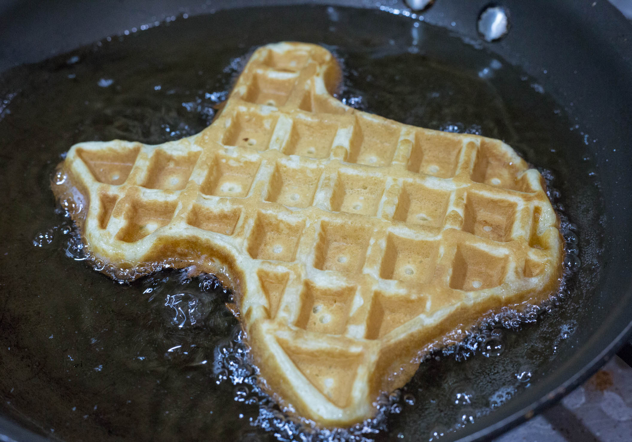 A churro waffle in the frying pan