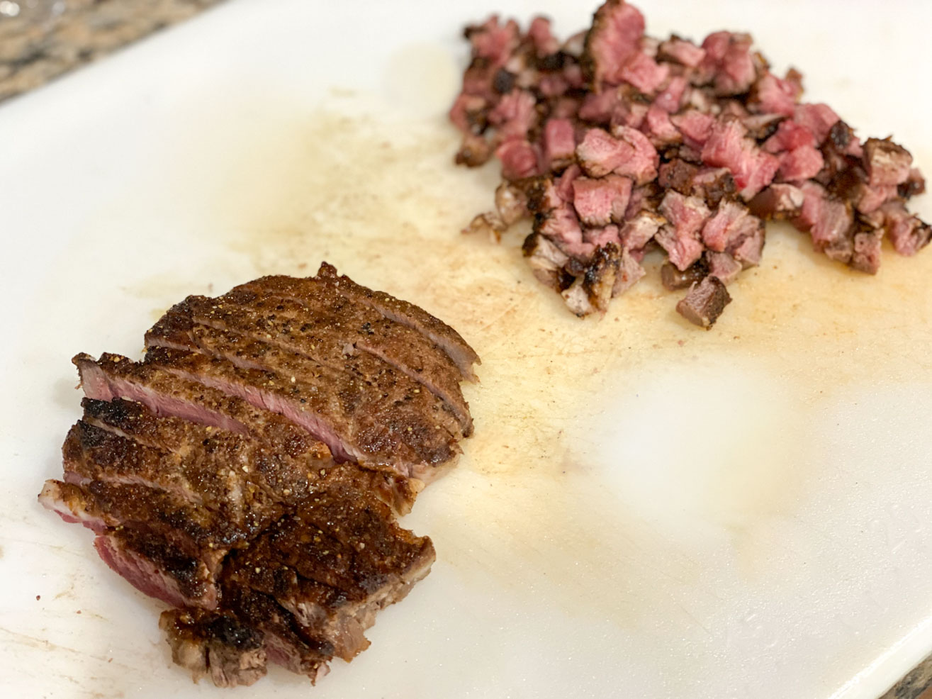 Sliced filet mignon cut into strips and then small cubes