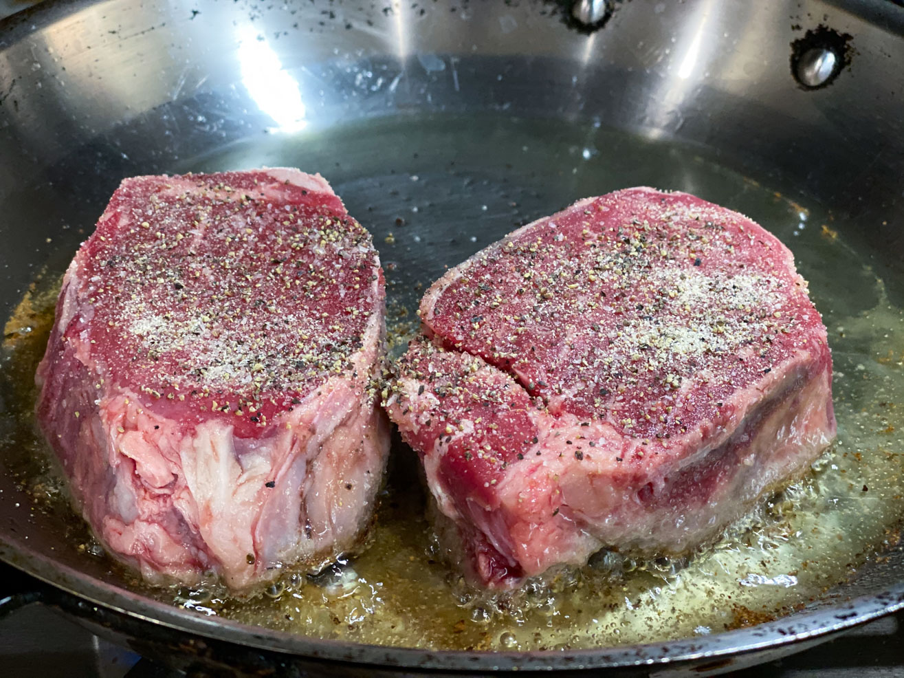 Filet Mignon searing in a skillet