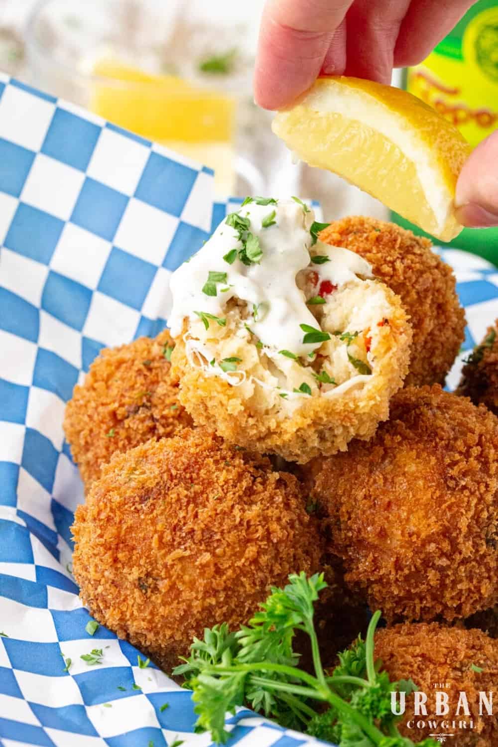 A basket of crab balls dipped in tartar sauce