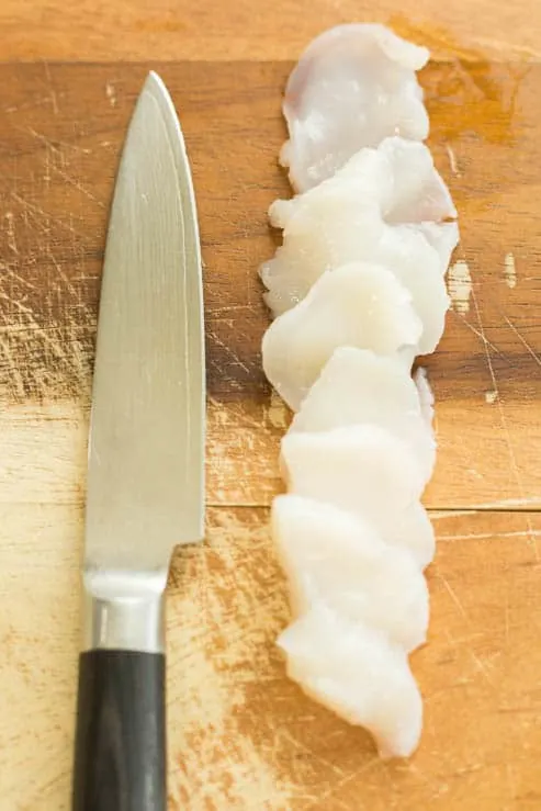 Sea Scallops thinly sliced with a knife. 