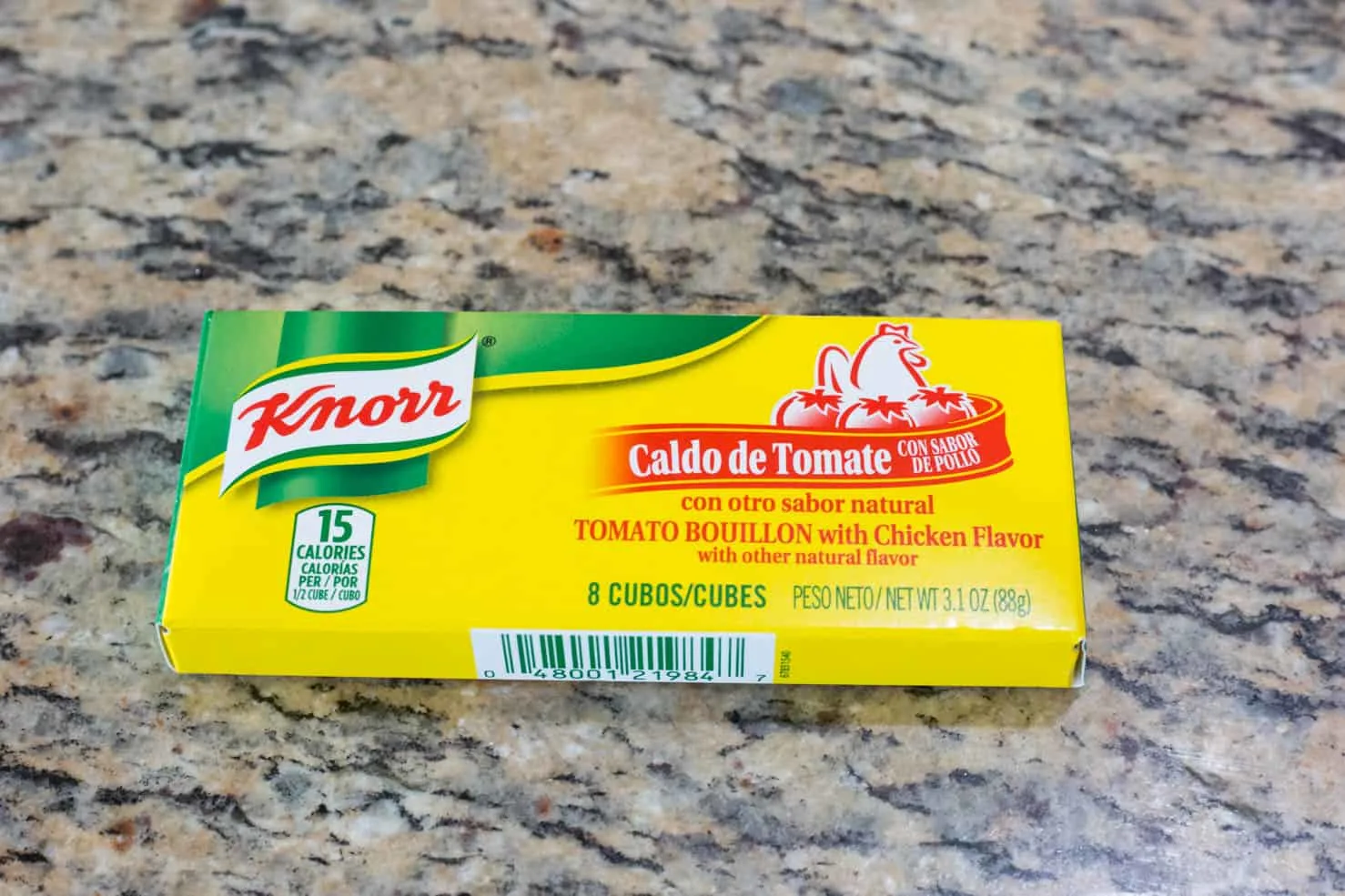 A green and yellow box of Knorr tomato bouillon, 3.1oz. 