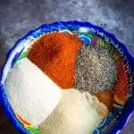 a colorful bowl full of carne asada spice blend