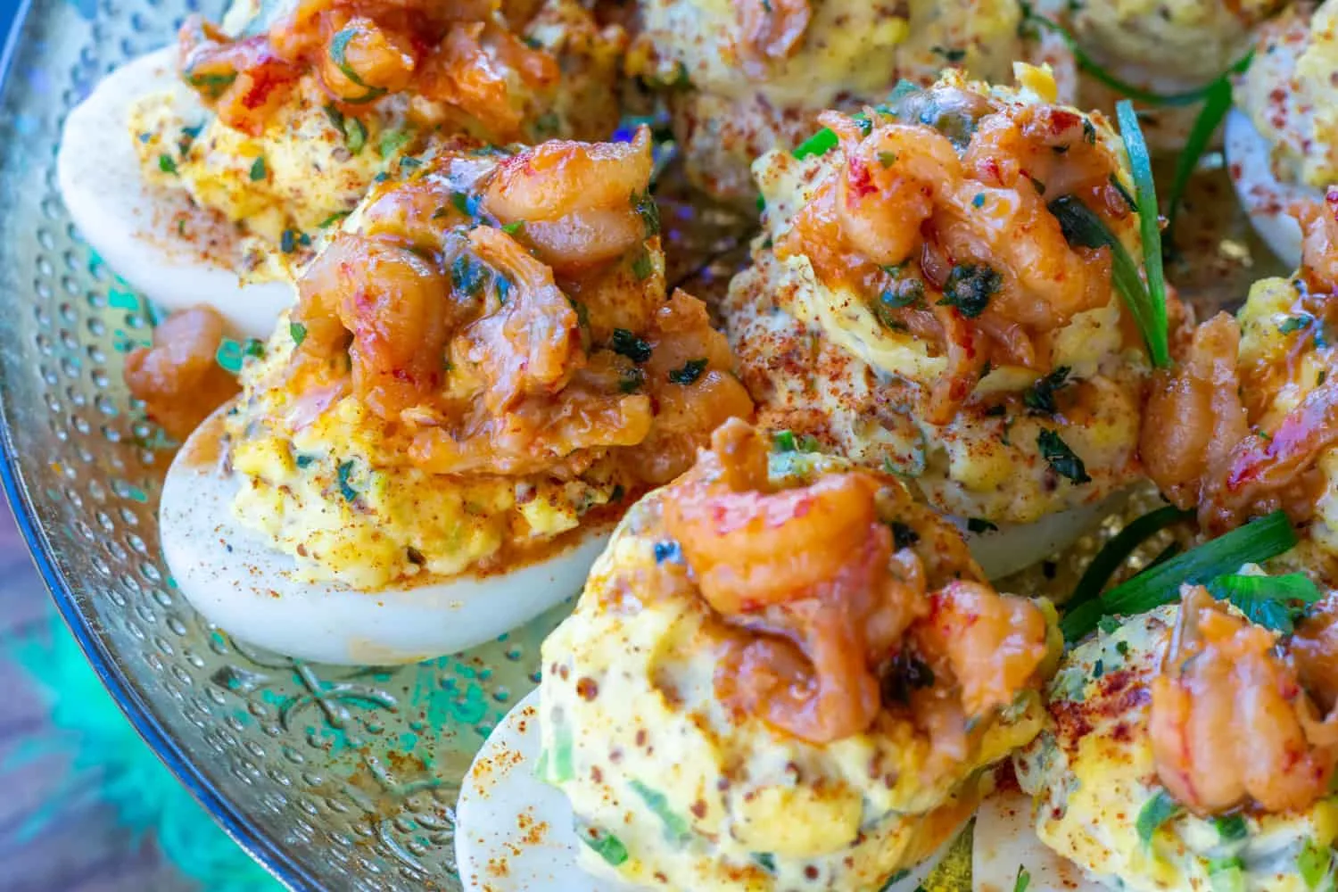 A silver platter of crawfish topped deviled eggs