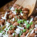 Texas Pinto Beans smothered with cilantro and crema, served out of a crockpot