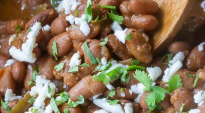 Texas Pinto Beans smothered with cilantro and crema, served out of a crockpot