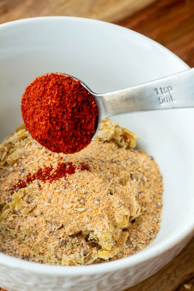A bowl of spices being made into the pork rub for these pork chops with hot honey glaze.