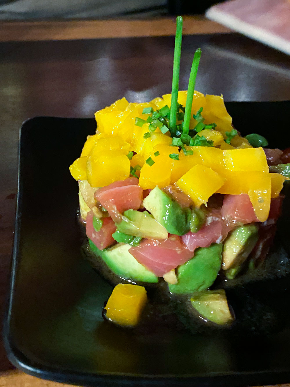 A salmon tartar and mango tower