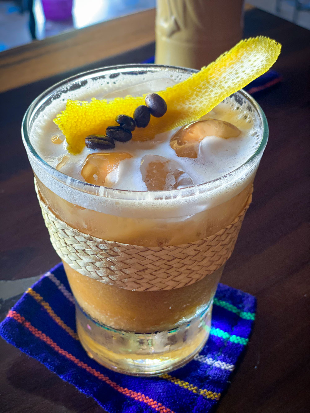 A tiki cocktail with coffee beans at Tiny Tiki Hut