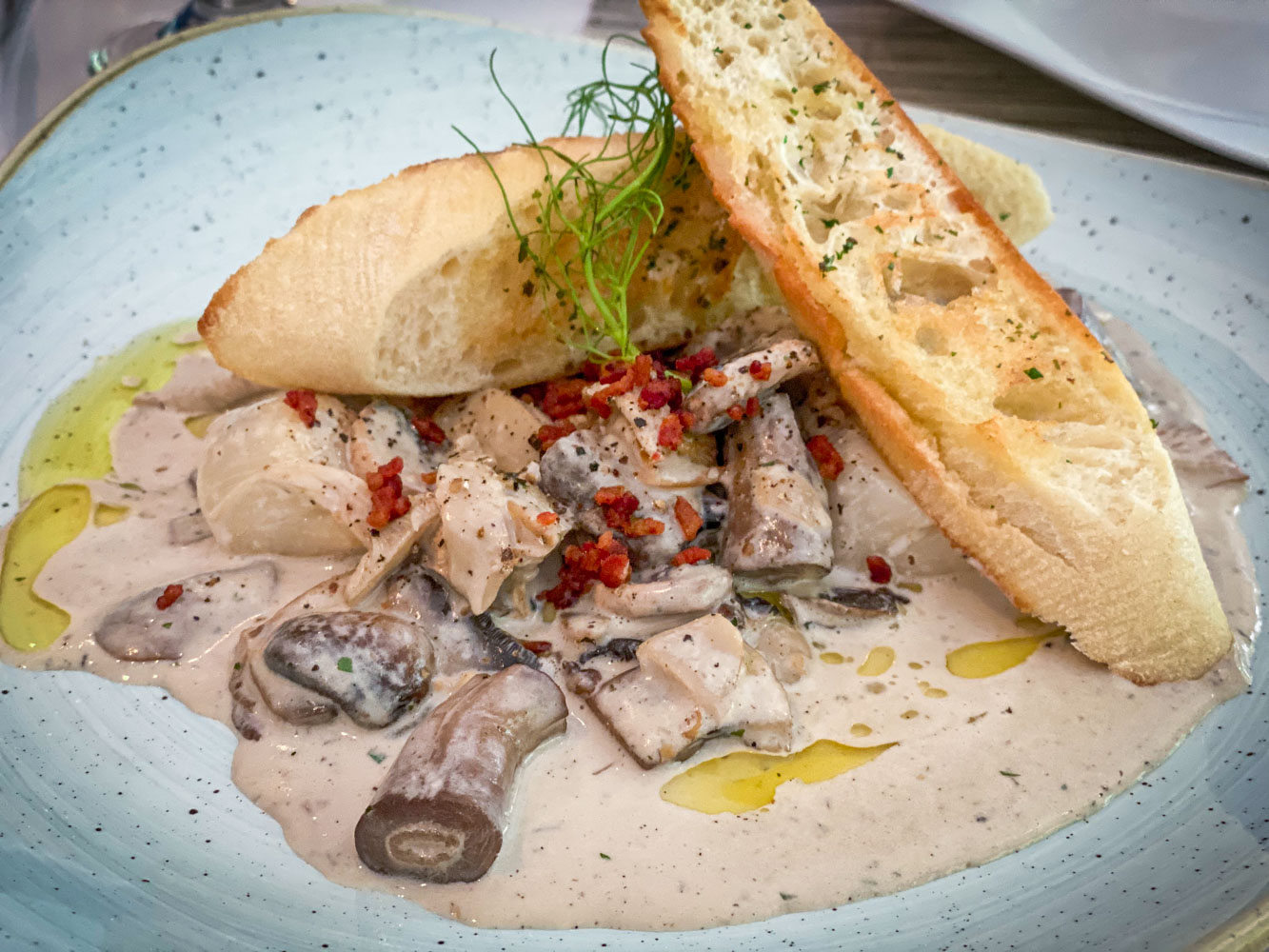 A mushroom bruschetta at a fine dining restaurant.