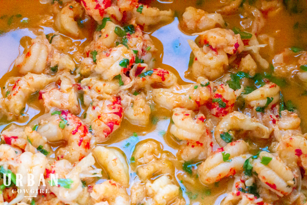 crawfish scampi in garlic butter in a colorful pan