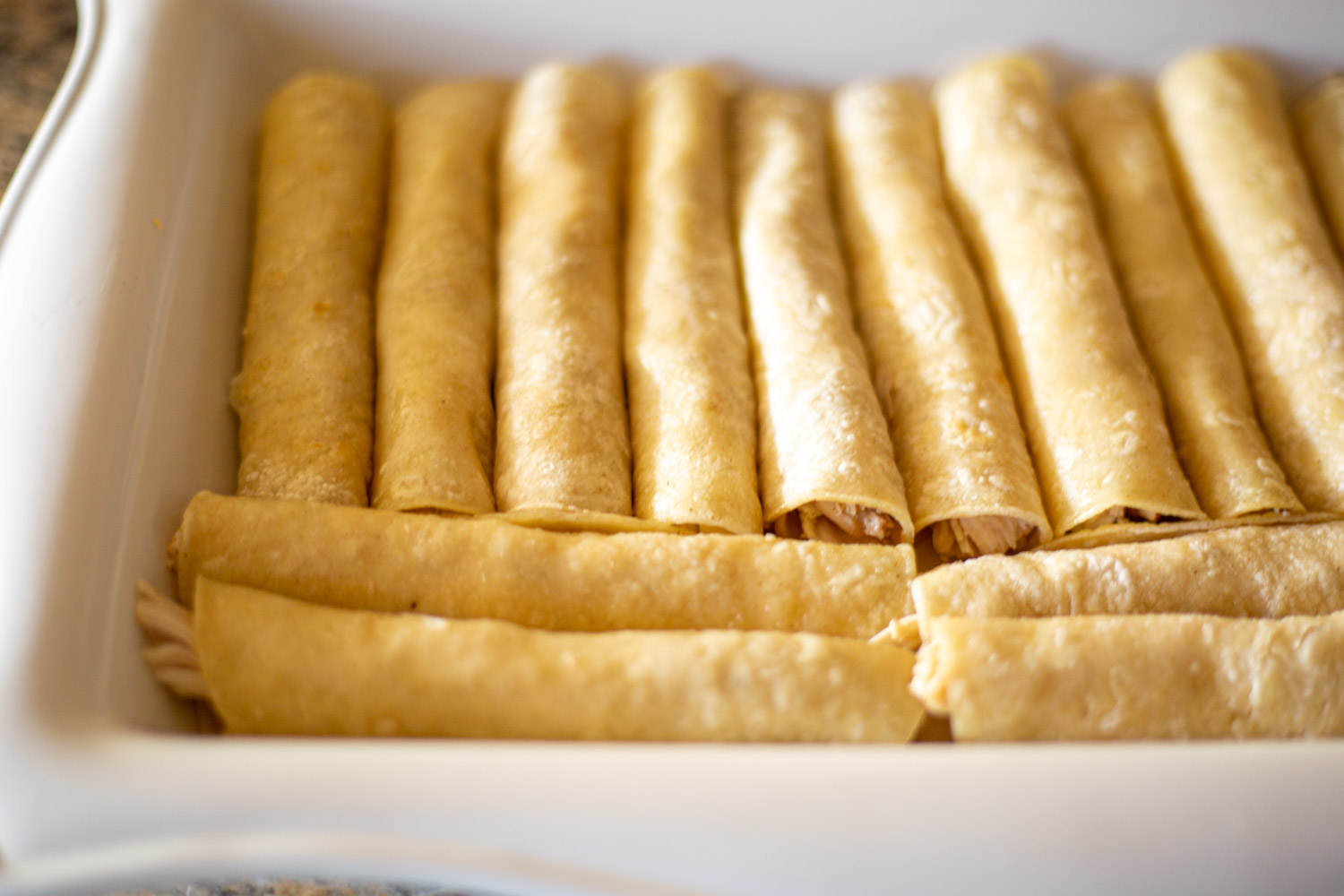 Shredded Chicken rolled into Enchiladas