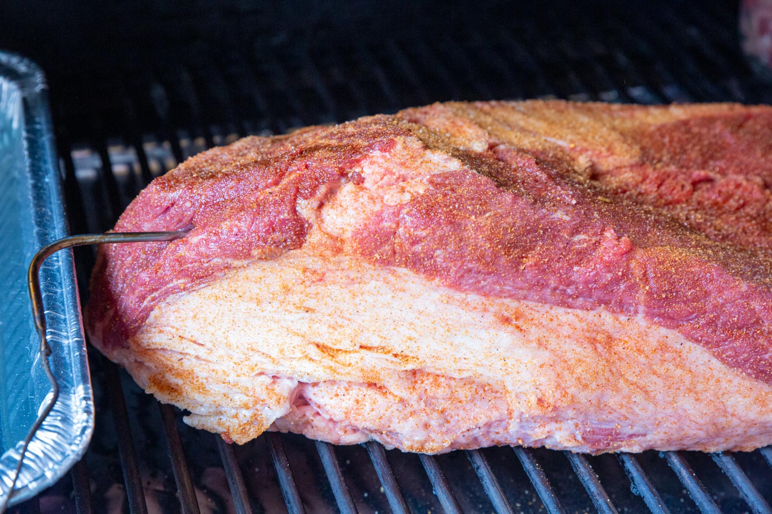 A temperature probe inserted into the thickest part of the brisket. 