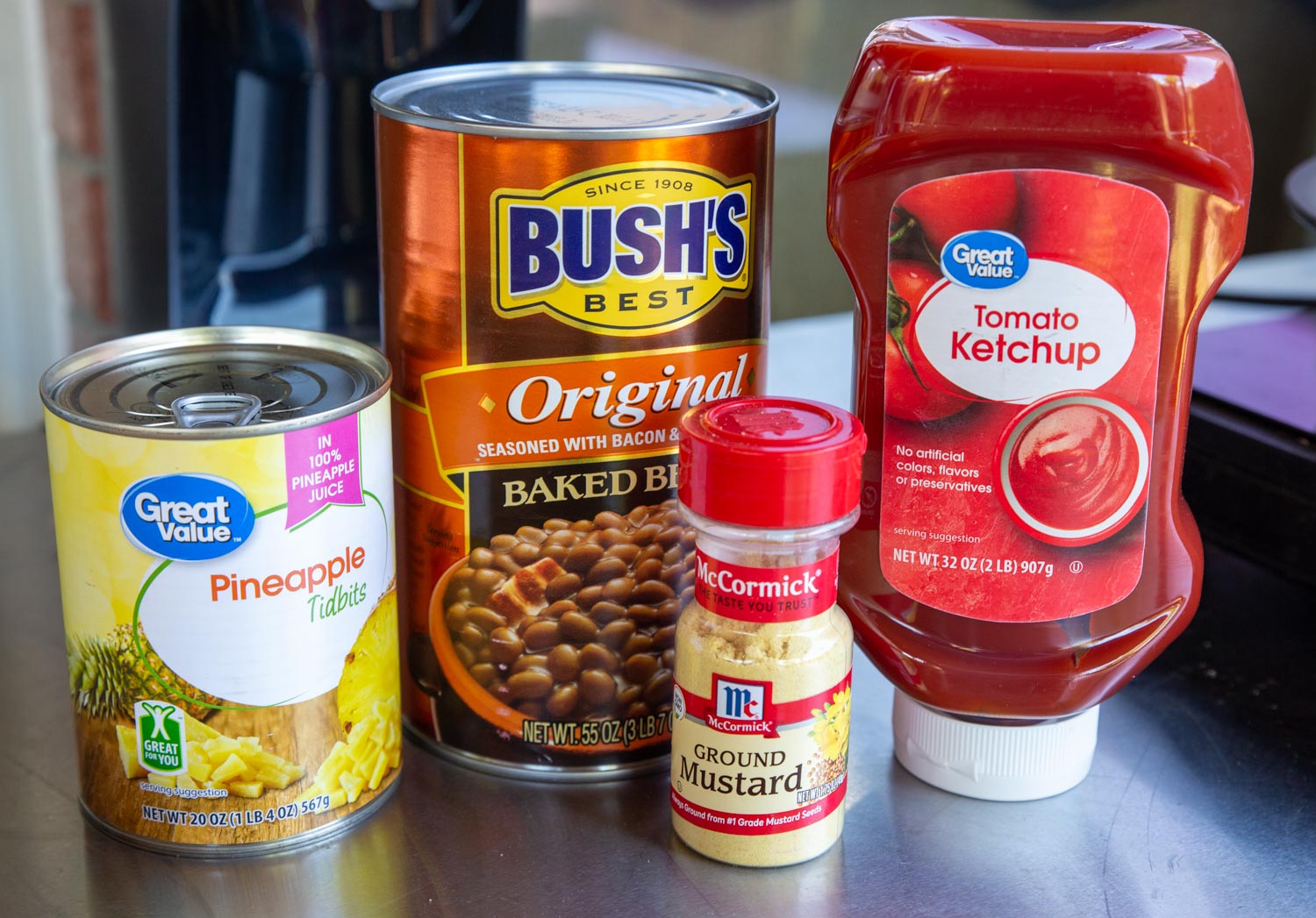 Ingredients for smoked baked beans- Bush's Best Baked Bean, ketchup, pineapple tidbits, dry mustard powder.