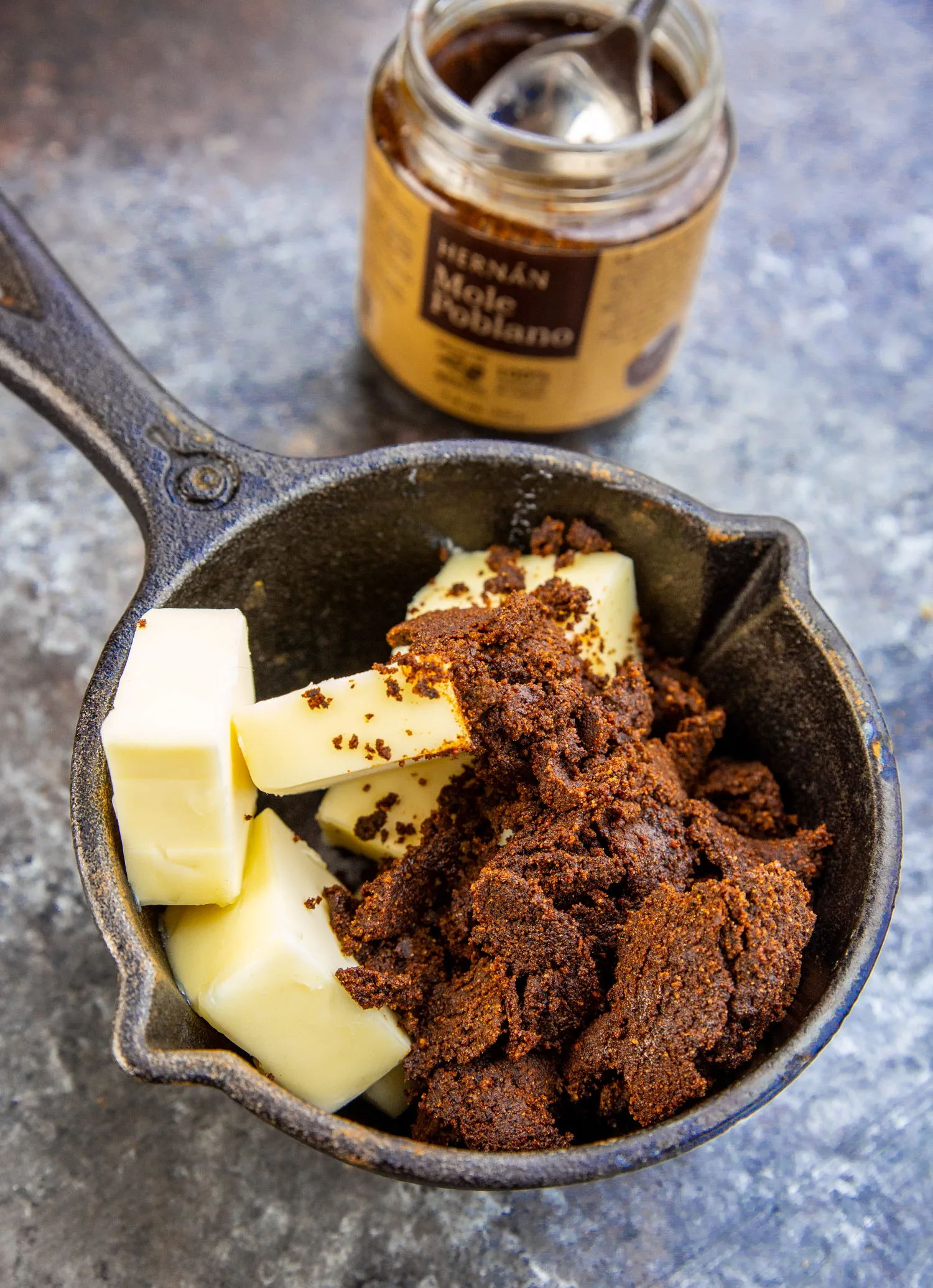 mole paste and butter in a cast iron pot