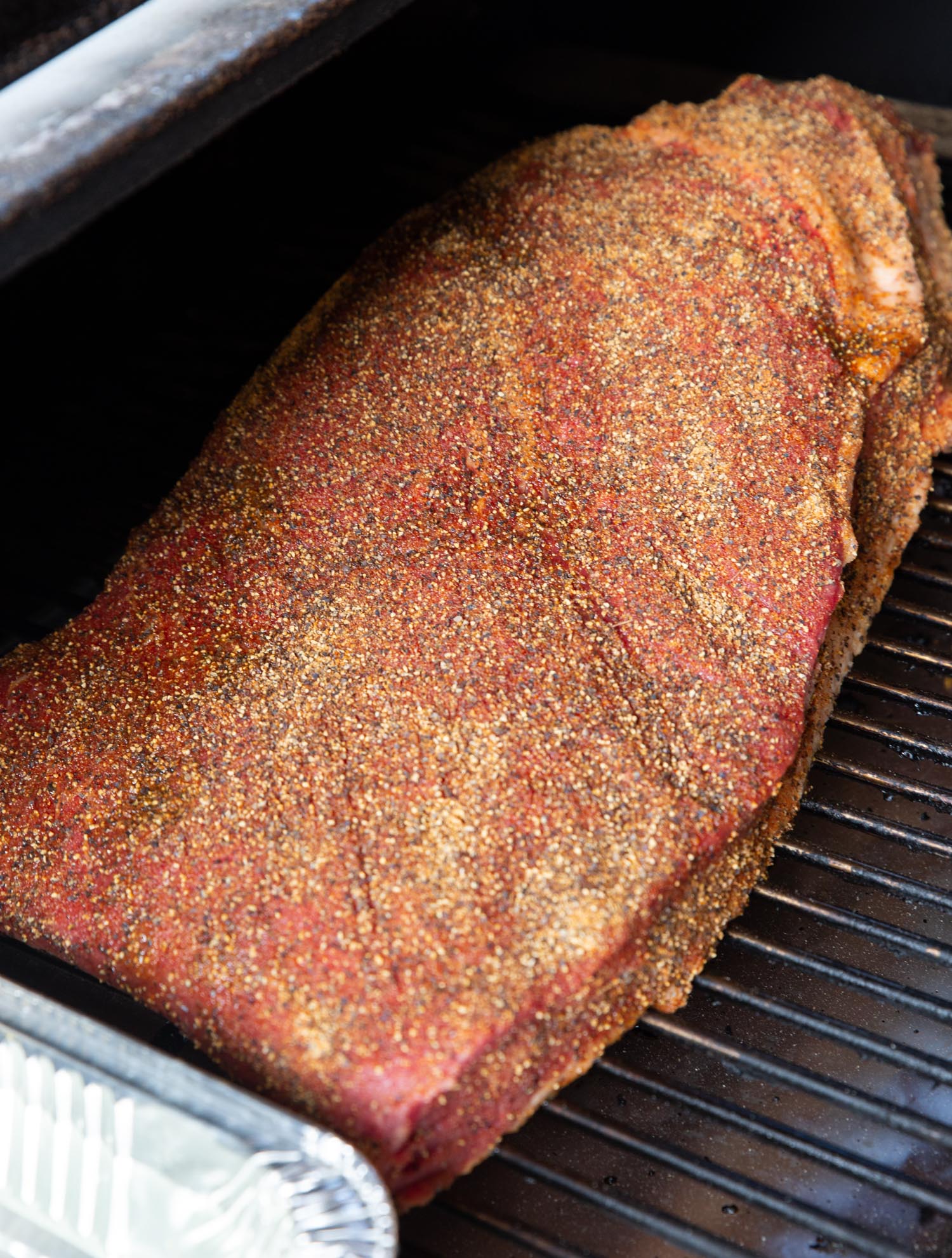A brisket covered in the award winning rub ready for the smoker. 