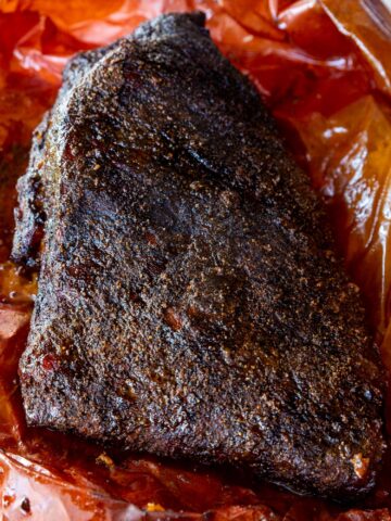 A 10 lb. brisket smoked and in peach butcher paper