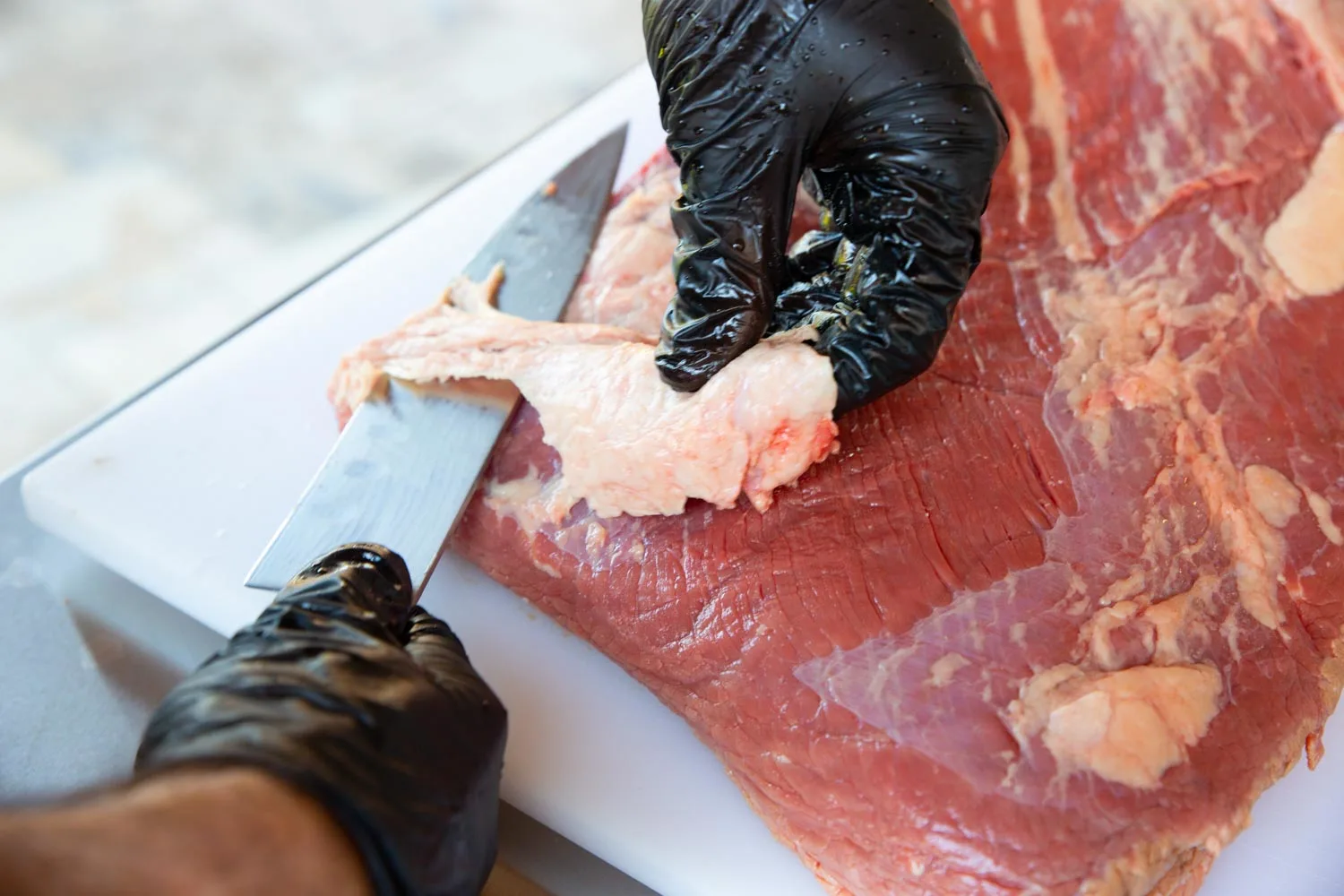 trim brisket on a cutting board