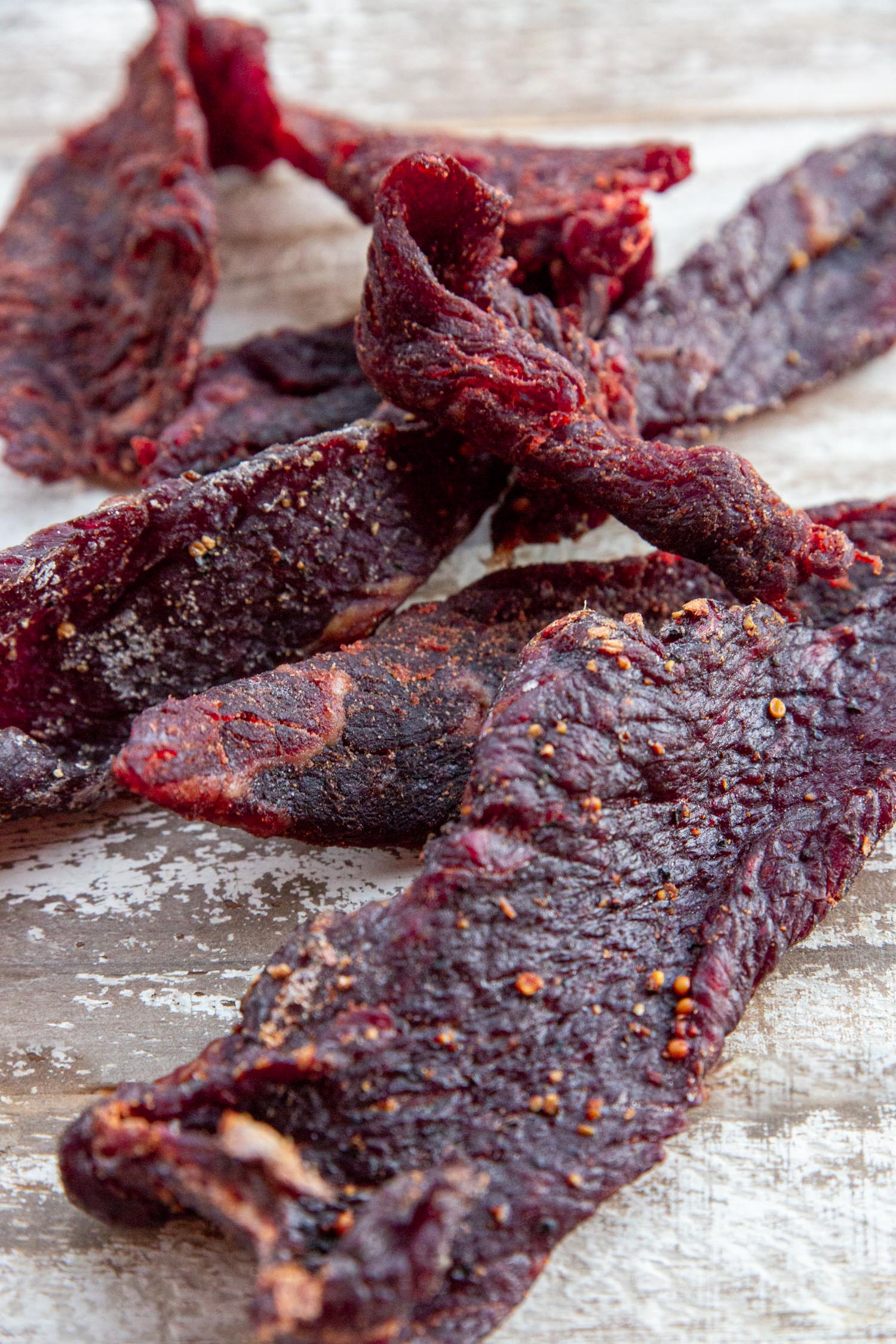 Various types of beef jerky laid out on a table