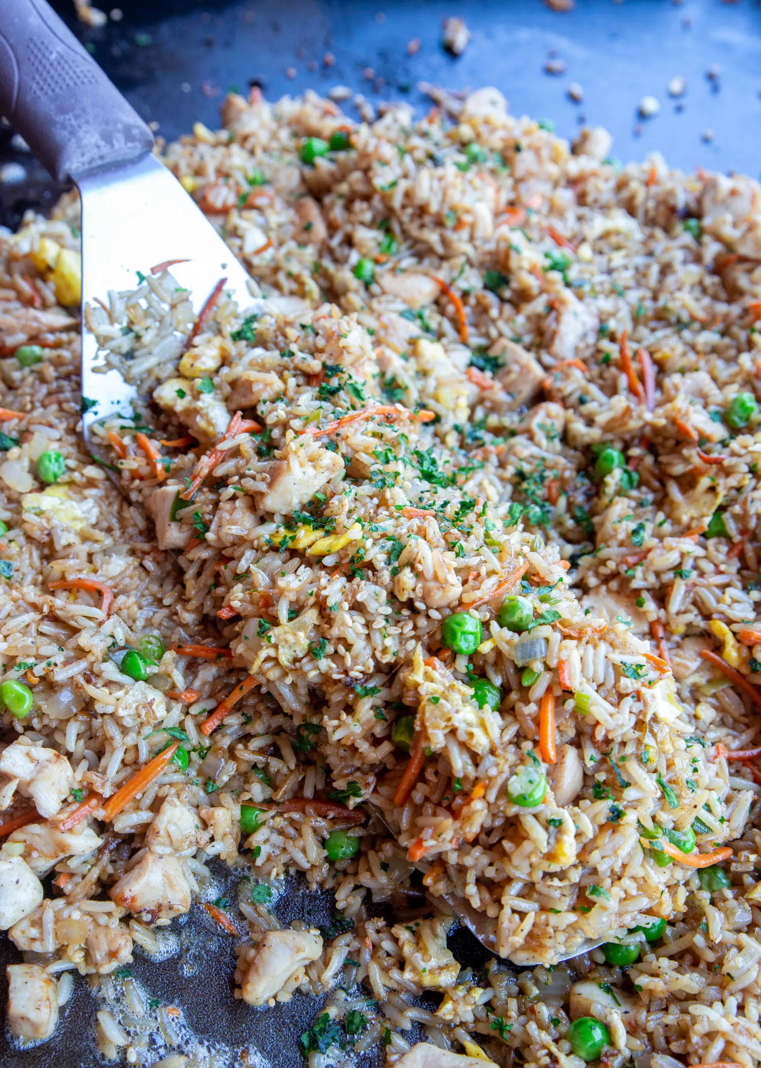 A spatula full of chicken fried rice recipe