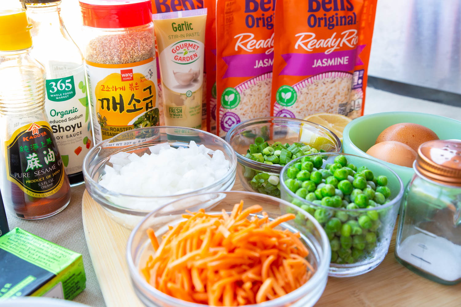 bowls of carrot, onion, rice, eggs, etc, The ingredients for blackstone griddle fried rice