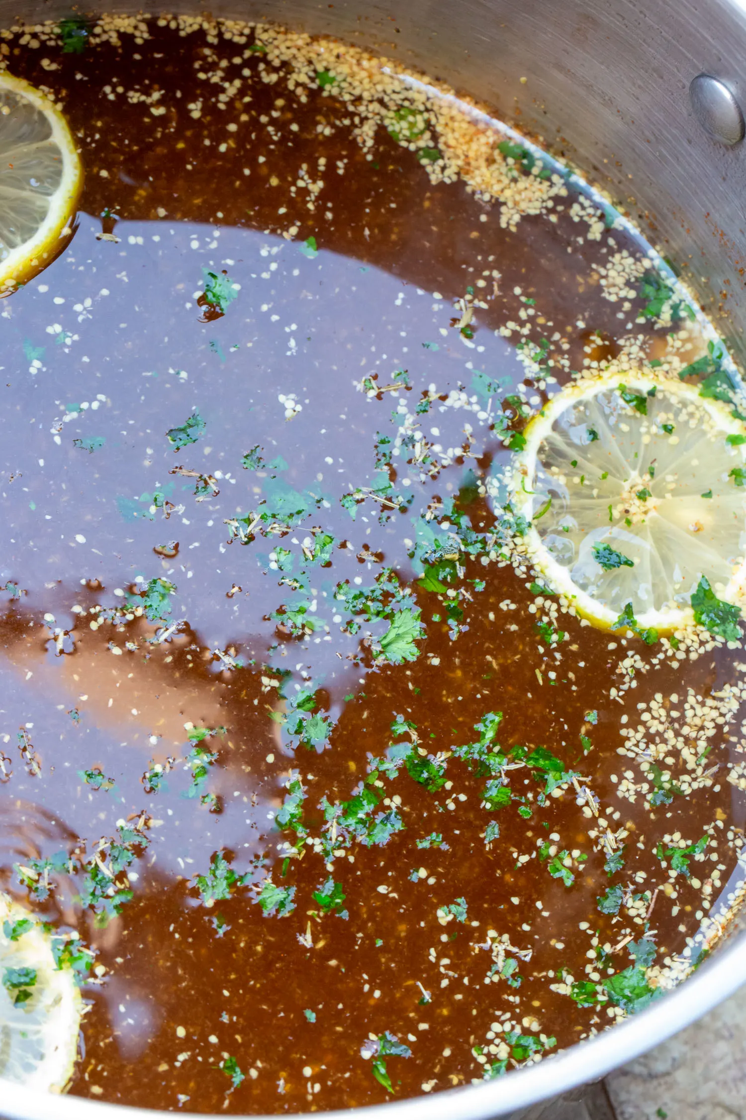 close up of herbs and ingredients in cajun turkey brine