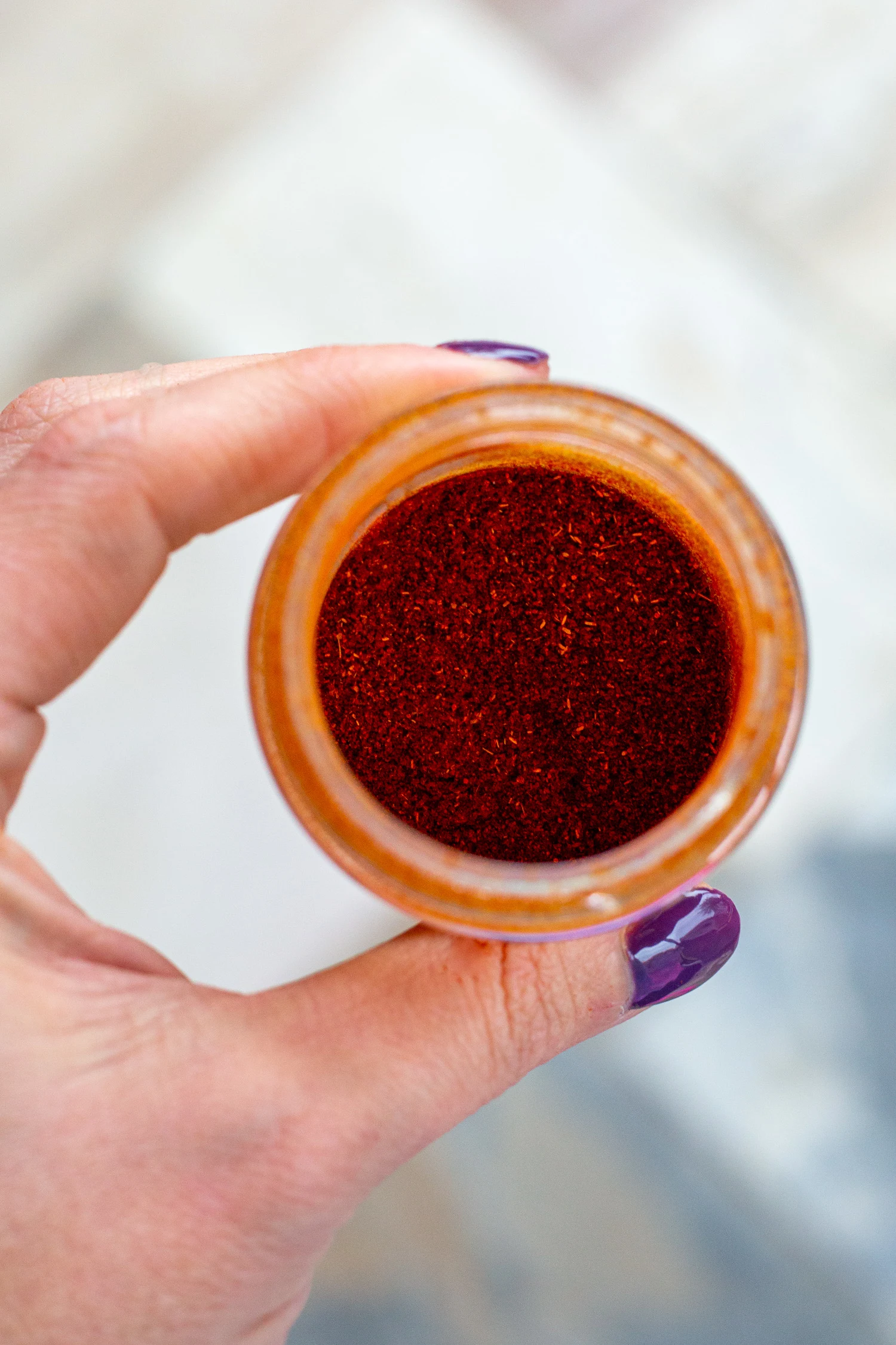 A close up of the chili powder in the bottle.
