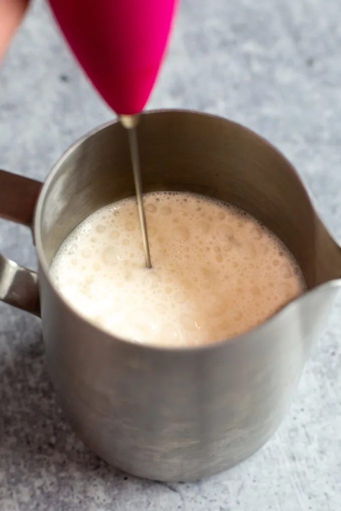 frothed cream beginning to make small bubbles